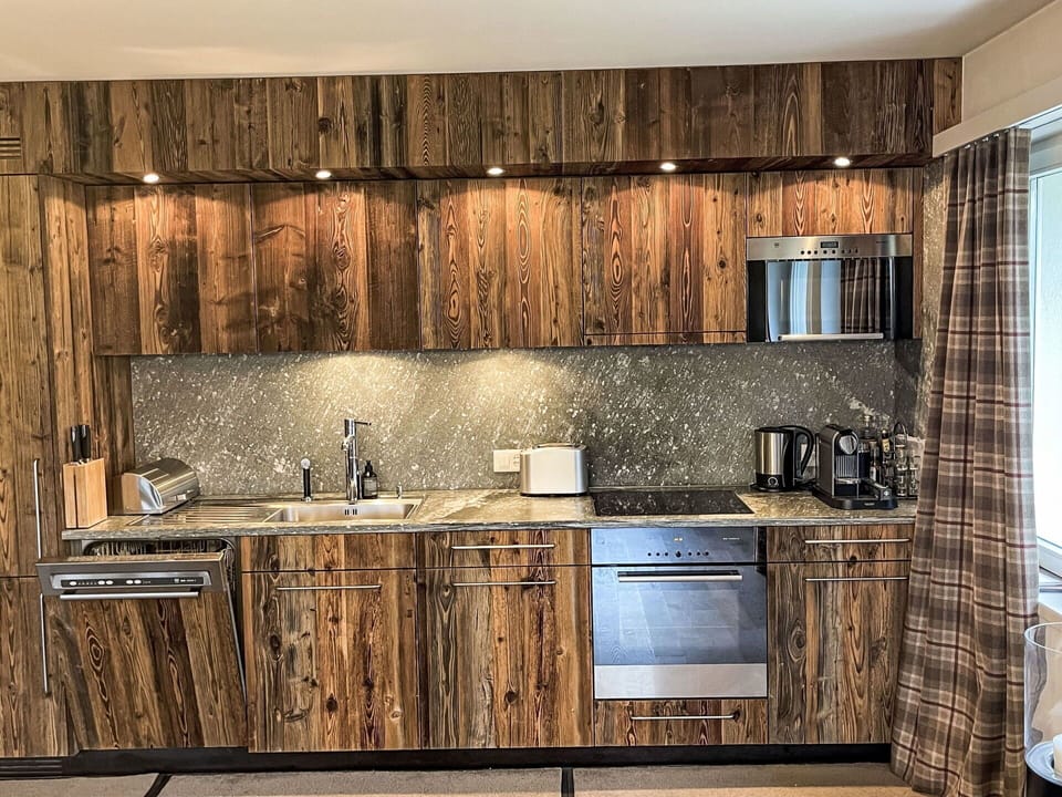 Wood, Interior Design, Countertop, Kitchen, Wood Stain, Cabinetry, Room, Hardwood, Kitchen Appliance, Plank