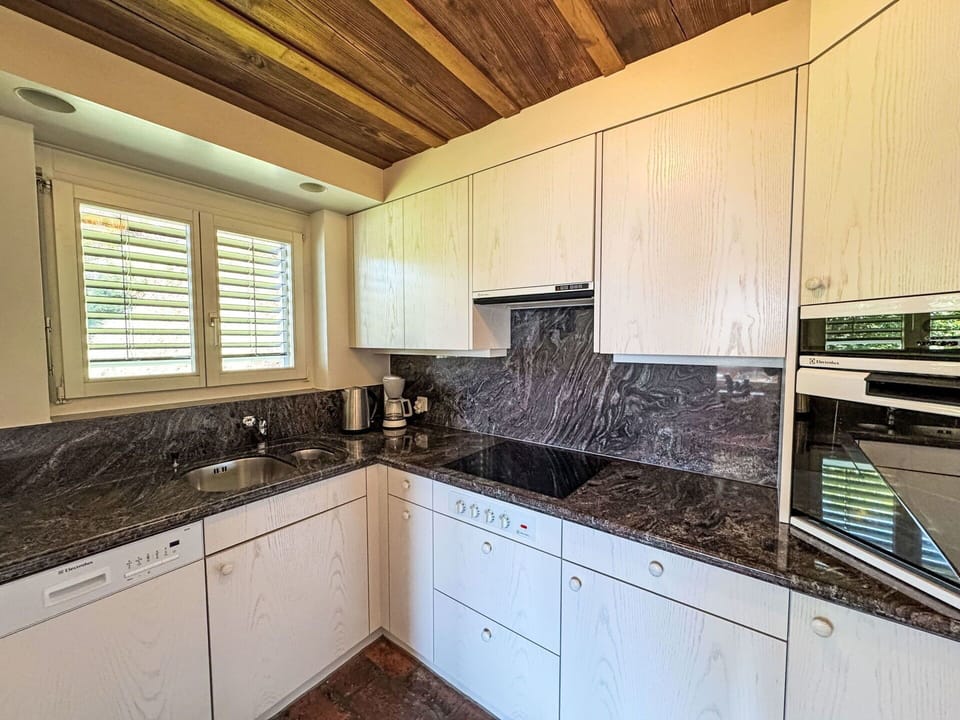 Kitchen, Countertop, Wood, Kitchen Appliance, Flooring, Cabinetry, Floor, Major Appliance, Home Appliance, Stove