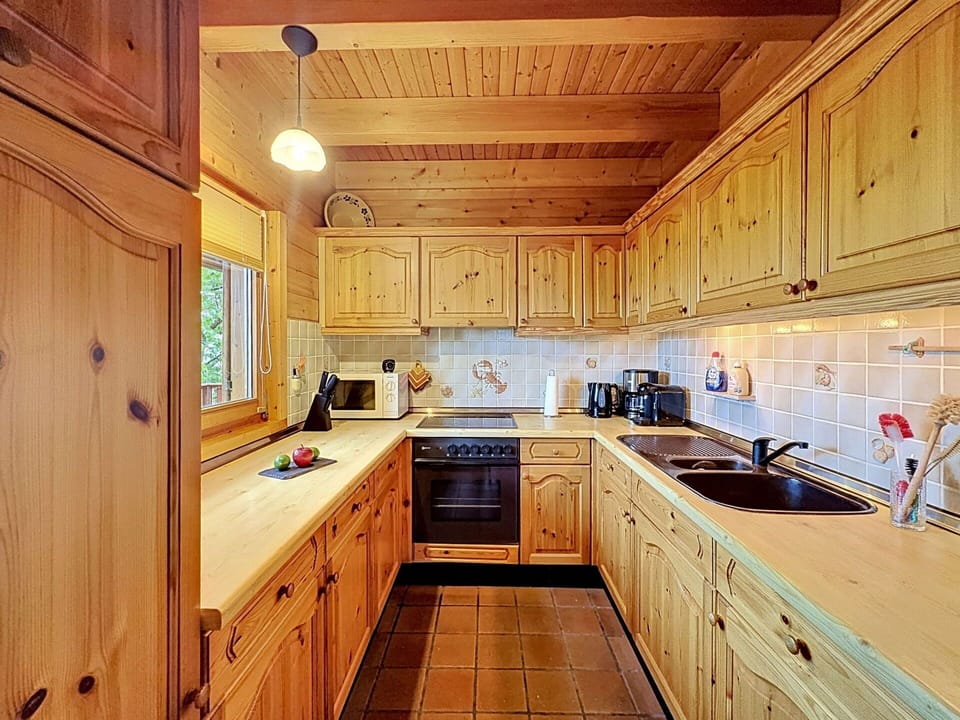 Kitchen, Wood, Countertop, Cabinetry, Kitchen Appliance, Flooring, Interior Design, Ceiling, Major Appliance, Wood Stain