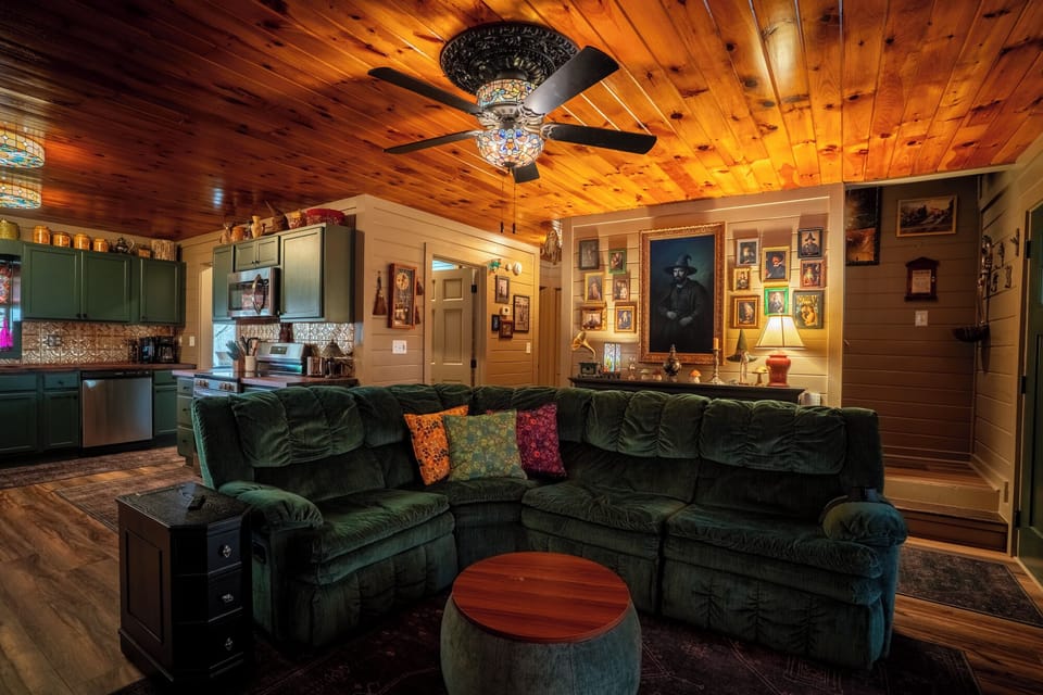 Main living room with warm lighting and custom wizard décor.