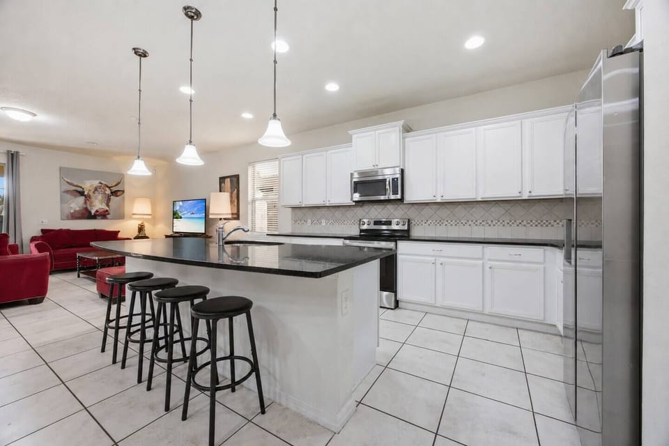 Kitchen island, stainless steel appliances, electric range