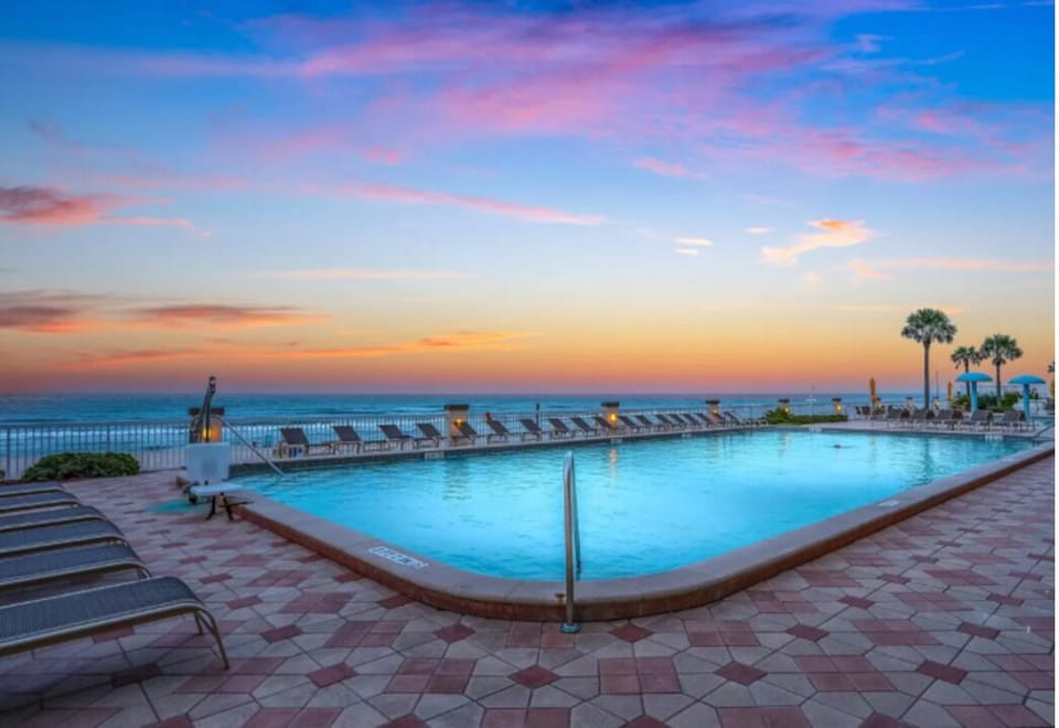 A serene escape by the pool with ocean views.