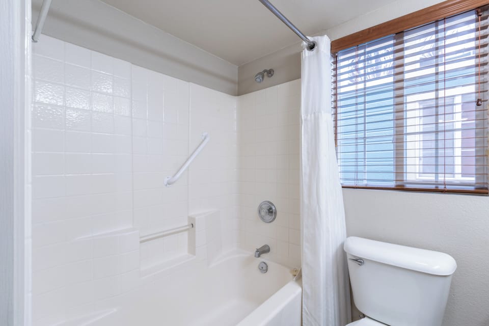 Refresh in a clean, bright bath with shower-tub combo.