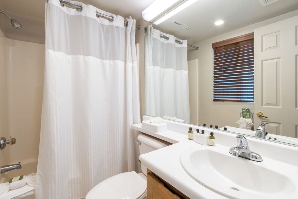 Refresh easily with bright vanity space and shower-tub combo.