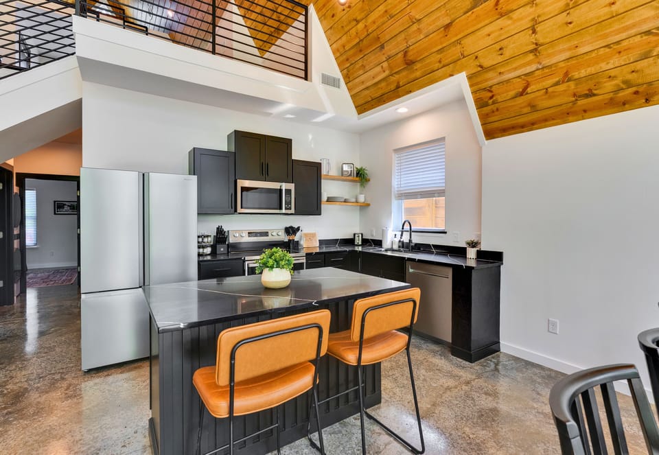 The open kitchen and dining layout make cooking, gathering, and sharing meals feel easy, warm, and connected.