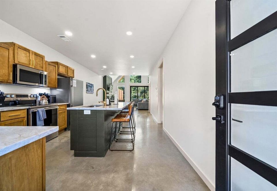 Spacious kitchen with all the tools and room you need for group dinners and morning waffles.