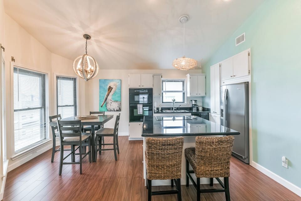 Table seats 4, 2 at the kitchen island. Single oven, microwave, countertop range
