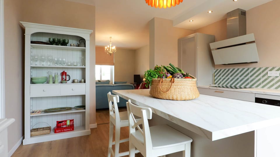 The well-equipped fitted kitchen has a useful Island Unit