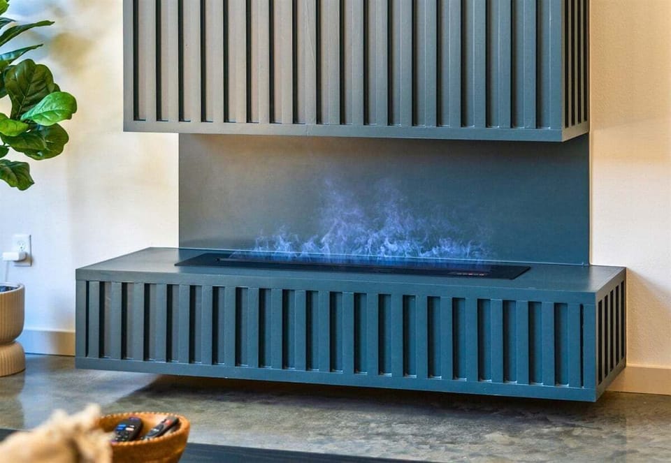 Modern fireplace with sleek black detail—style meets cozy in this space.