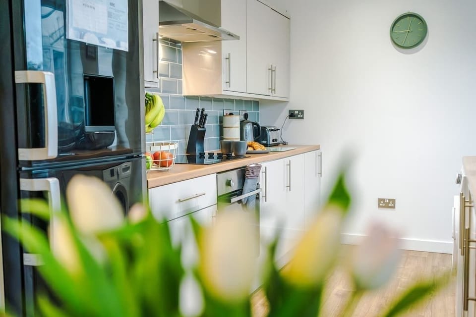 Fully equipped modern kitchen with all essentials for home cooking.