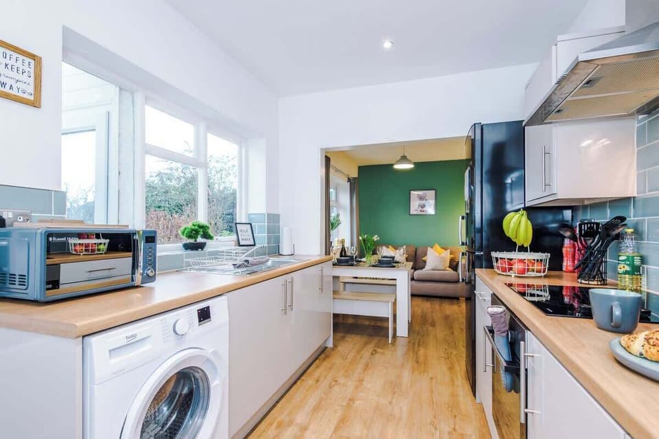 Fully equipped modern kitchen with all essentials for home cooking.