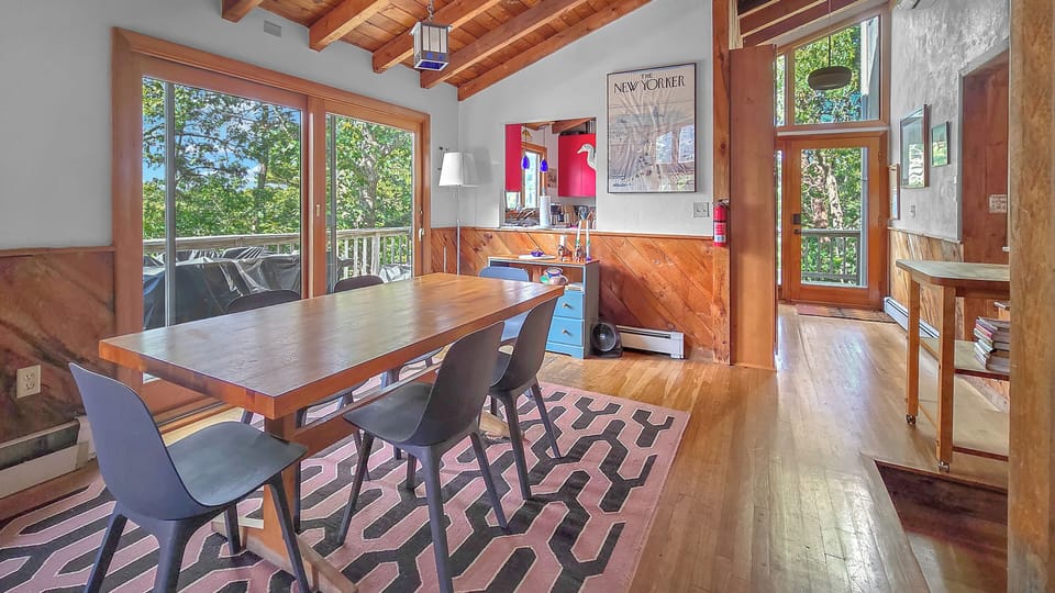 Dining room with large table and slider to deck