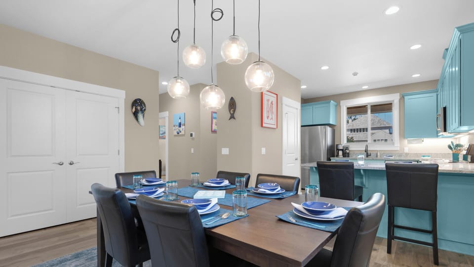 Your modern dining space awaits with elegant pendant lighting and stylish seating for memorable meals together.