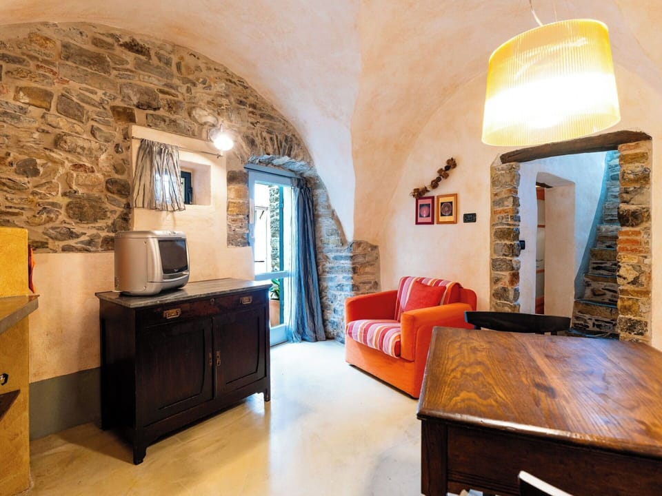 Wall, Furniture, Flooring, Ceiling, Interior Design, Floor, Stone Wall, Chair, Light Fixture, Wood Stain