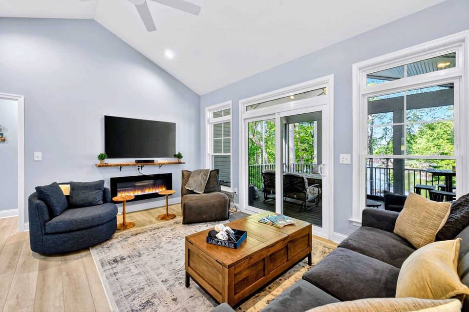 Great Room - Vaulted ceilings with skylight and a wall of cove-view windows.