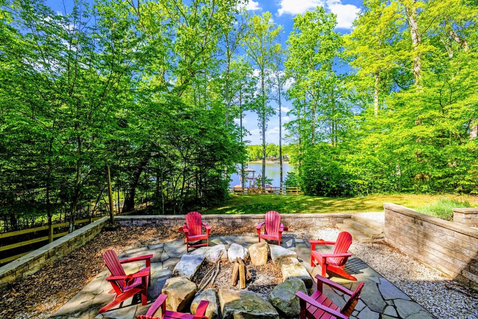 Backyard - The full setting: water, lawn, trees, and the home stacked into the landscape.