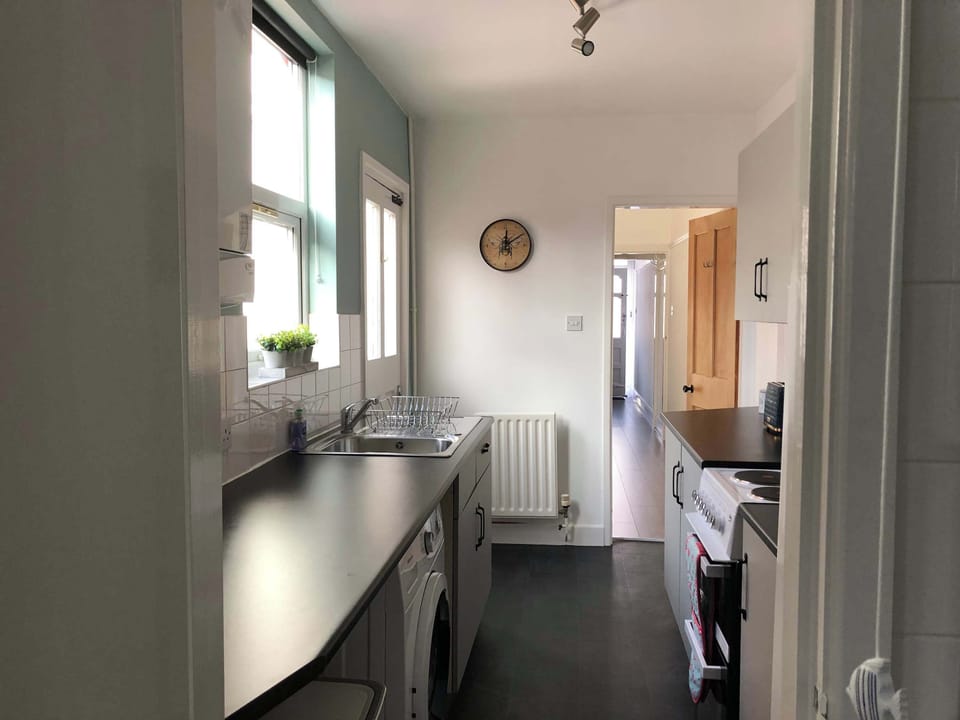 Kitchen: Bright and airy space with modern appliances for your culinary adventures!