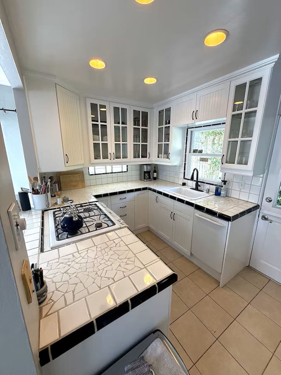 Kitchen includes coffee maker, microwave, dishwasher and cooking essentials 