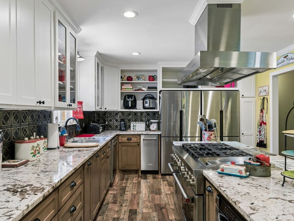 Well stocked kitchen with ice maker, double fridge, large stove