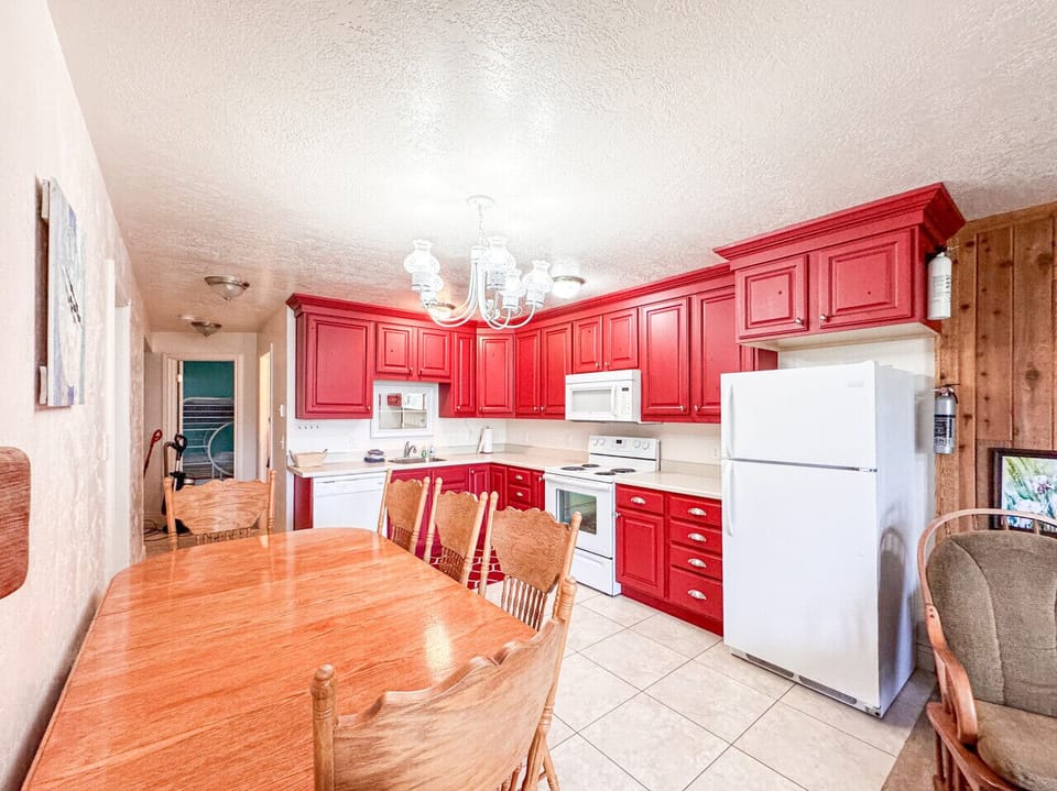 Spacious dining area and vibrant kitchen create the perfect setting for shared vacation memories.