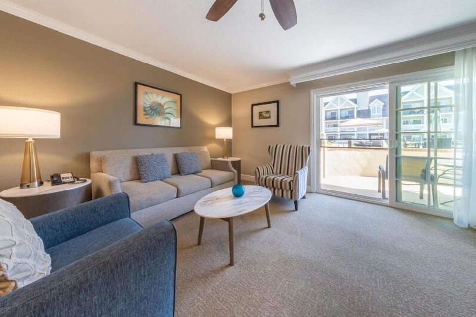 Lounge comfortably by the sunlit balcony after a day out.