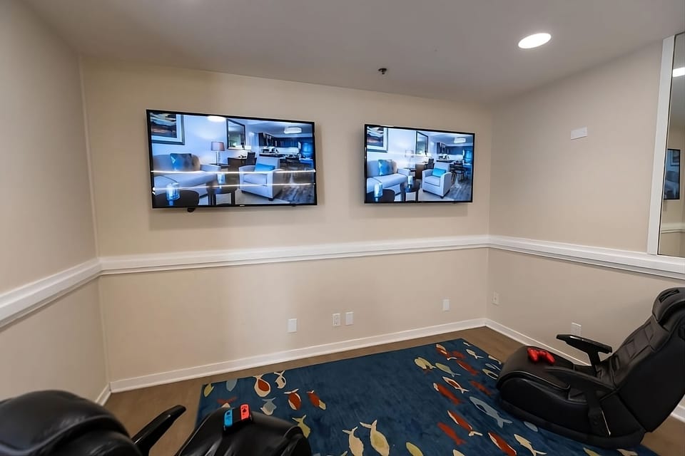 Kick back in the game room with big screens and comfort.
