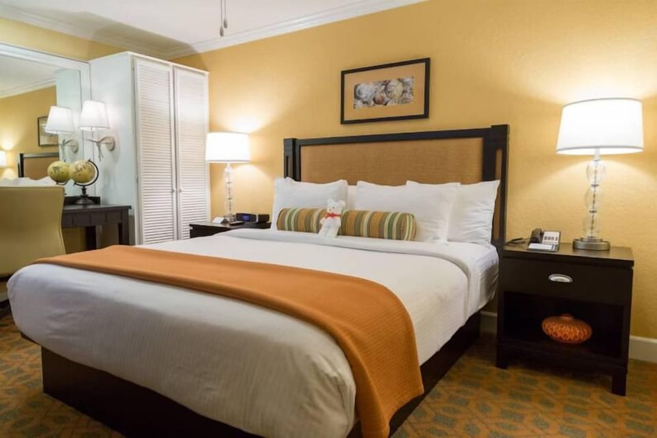 Unwind into crisp linens and warm, calming bedside glow.
