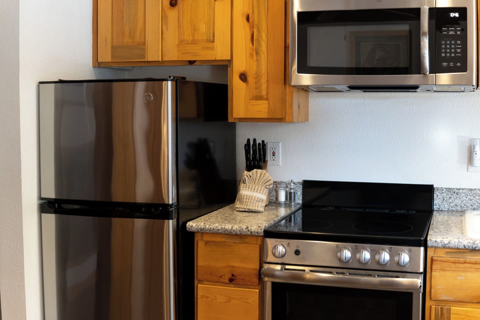 Prep breakfast easily with convenient stove, microwave, and fridge.