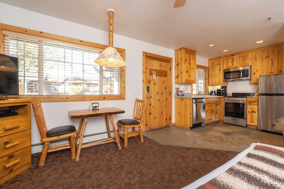 Cook hearty meals in a fully equipped, cabin-style kitchen.
