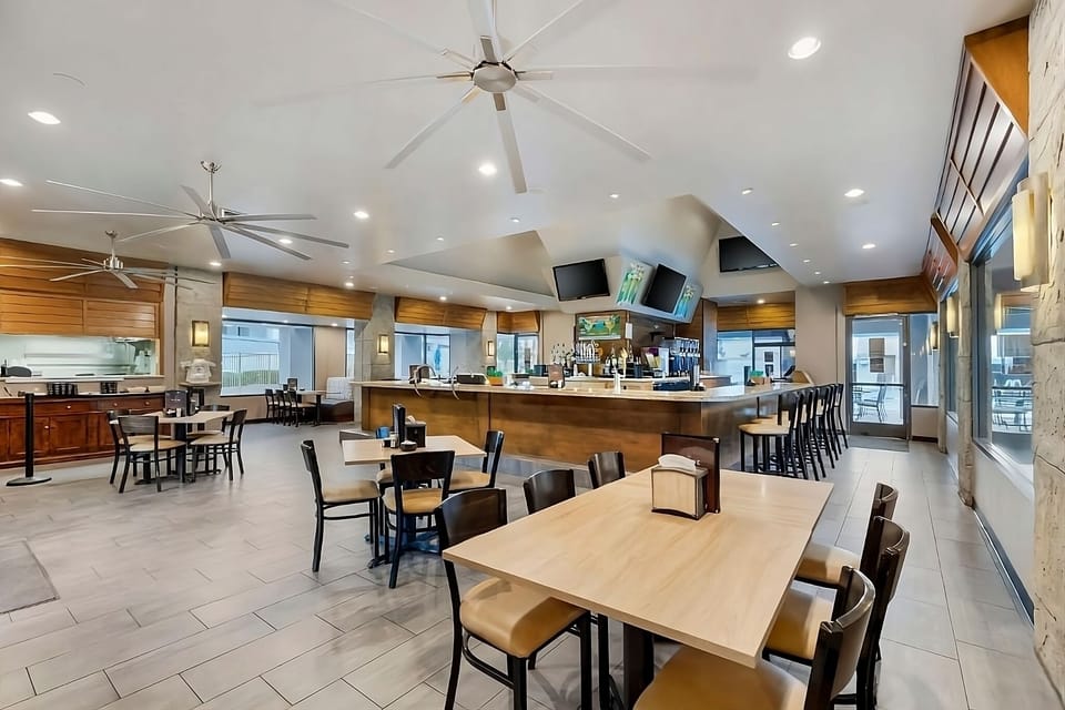 Enjoy relaxed meals in the airy dining room beside the bar.