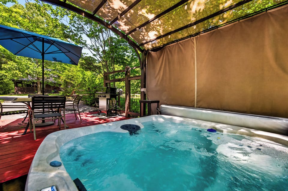 Shaded hot tub with lighting for nights. 
