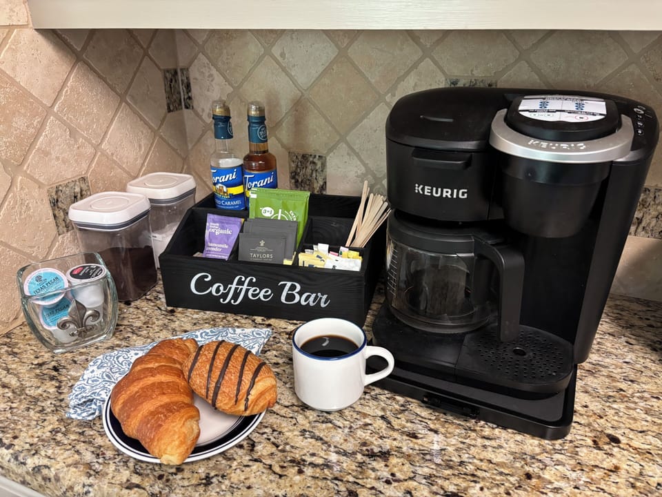 Coffee bar stocked w to-go cups, coffee, tea, hot chocolate!