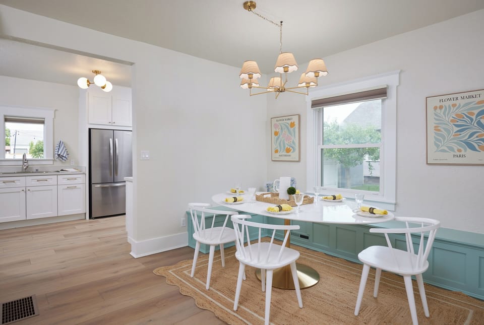 Dining table near the kitchen for shared meals and conversation.