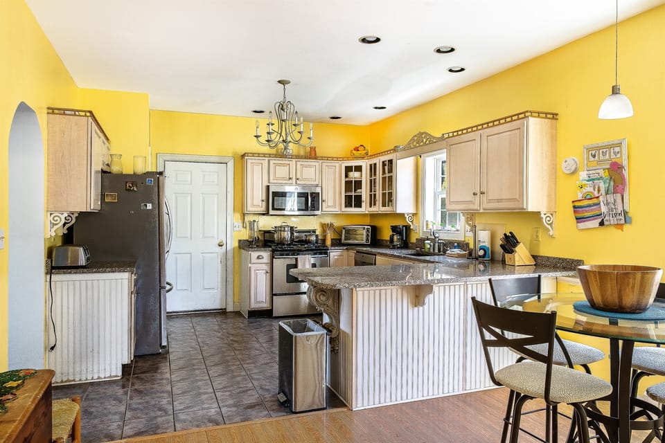 The fully equipped kitchen is designed for social meals on the "quiet side." Enjoy stone countertops, a breakfast nook for four, and an open layout that keeps the chef connected to the group while prepping trail snacks or a Maine lobster dinner.