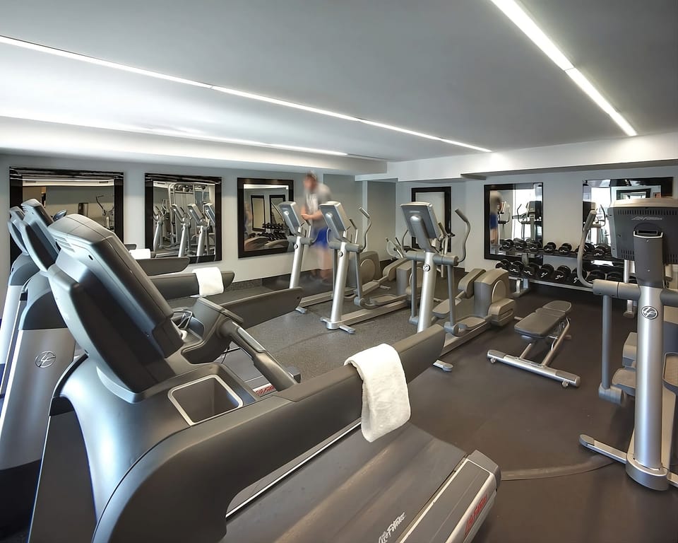 Recharge with a full workout in the bright, modern gym.
