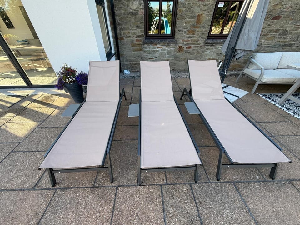 Relax by the pool on the folding sun loungers