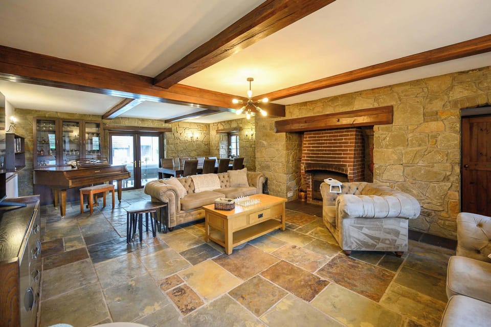 The true heart of the house is this magnificent, open-plan space, designed for effortless socialising and relaxation. 