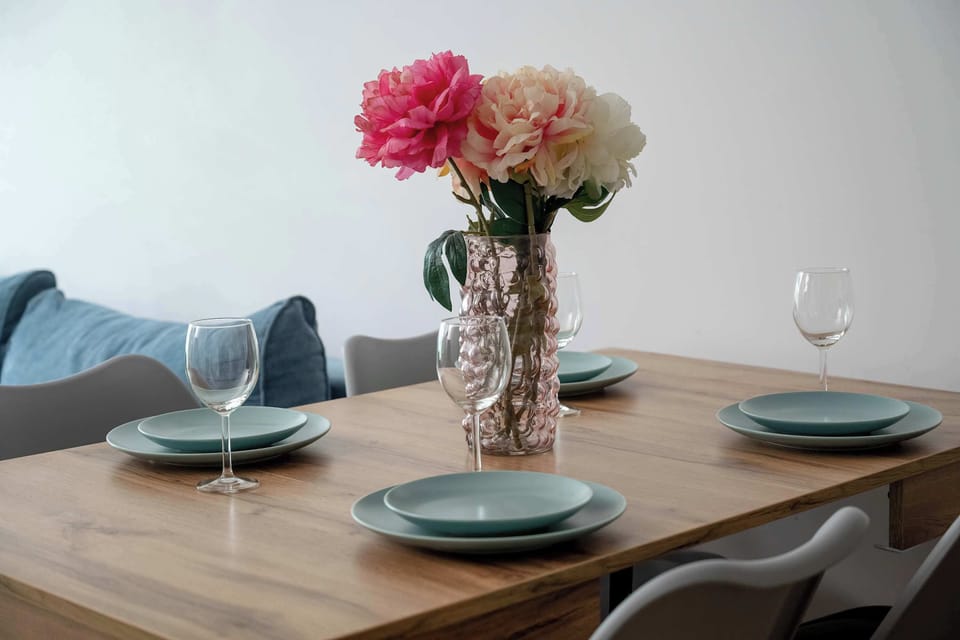 The living room's modern and stylish decor creates a welcoming atmosphere.