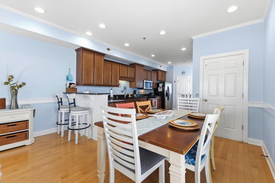 Picture yourself preparing meals in this bright, open kitchen and enjoying them at the welcoming dining table, all bathed in natural light and ready for your vacation memories.