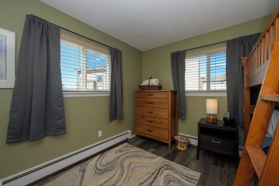 Your kids will love this cozy bedroom with sturdy wooden bunk beds and plenty of storage space for all their adventures.