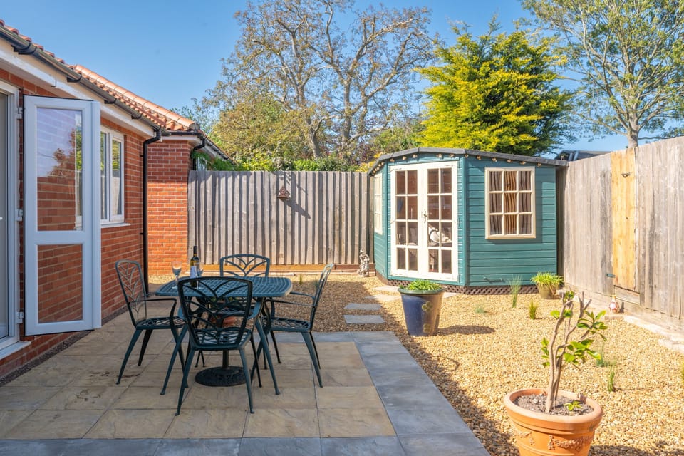 Enclosed courtyard to the rear with garden furniture