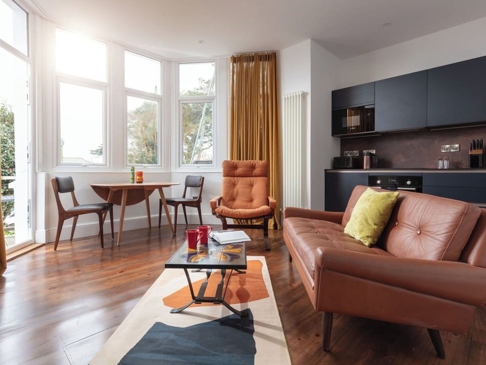 Furniture, Interior Design, Flooring, Floor, Couch, Wood, Living Room, Wood Flooring, Room, Chair
