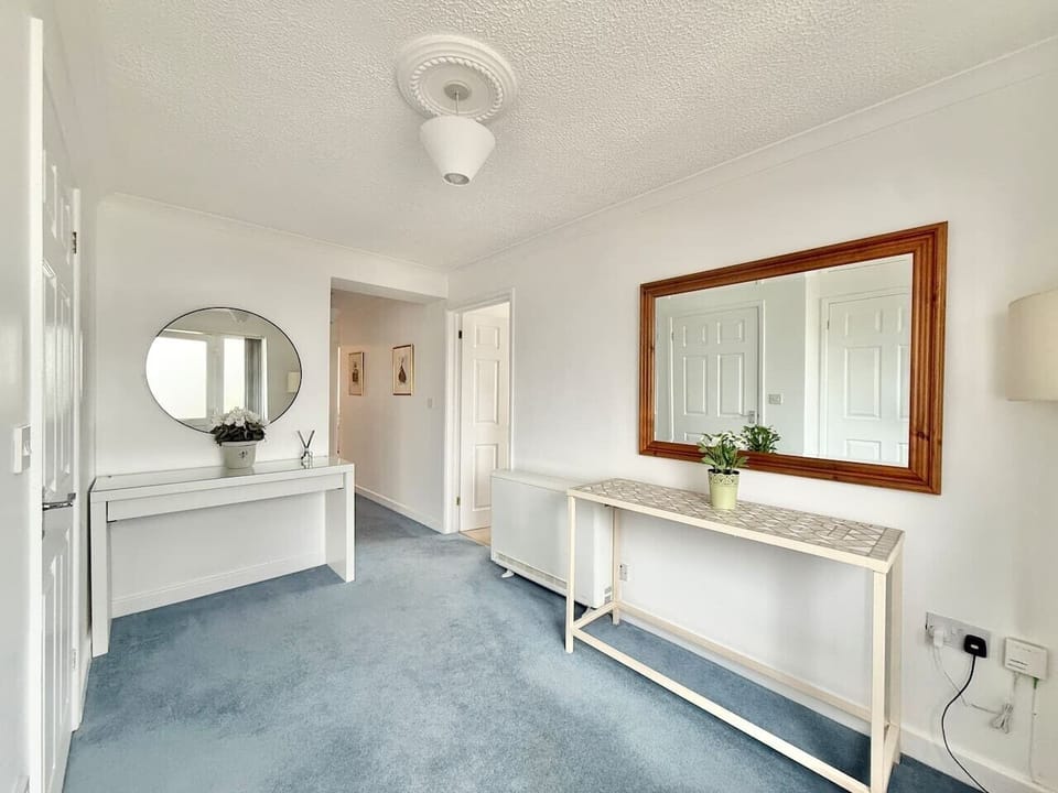 Inviting Hallway with access to the utlity room with tumble dryer