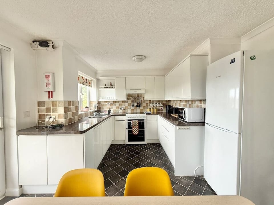 Well Equipped Kitchen with access to Balcony and Dining area