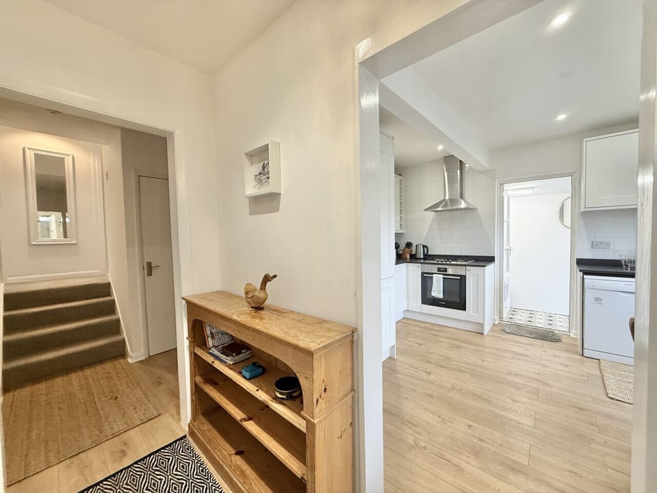 Hallway with a few steps up to the double bedroom and single bedroom
