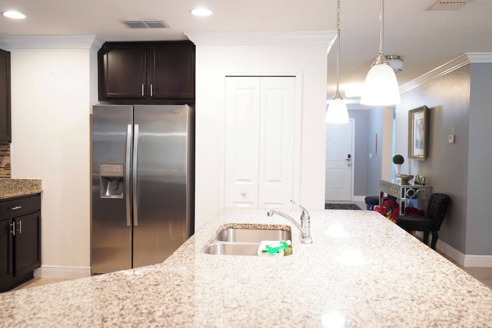 A perfect blend of style and function: a kitchen island that connects seamlessly to the living area and leads to the peaceful bedrooms.