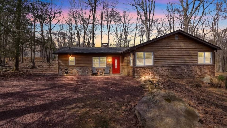 Rustic Cabin Exterior Nestled in Private Wooded Lot