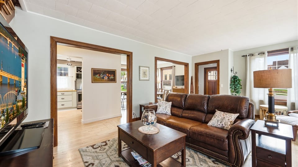 Main living area overlooks the kitchen, creating an open and connected space that’s perfect for entertaining, relaxing, and staying part of the conversation while meals are being prepared.