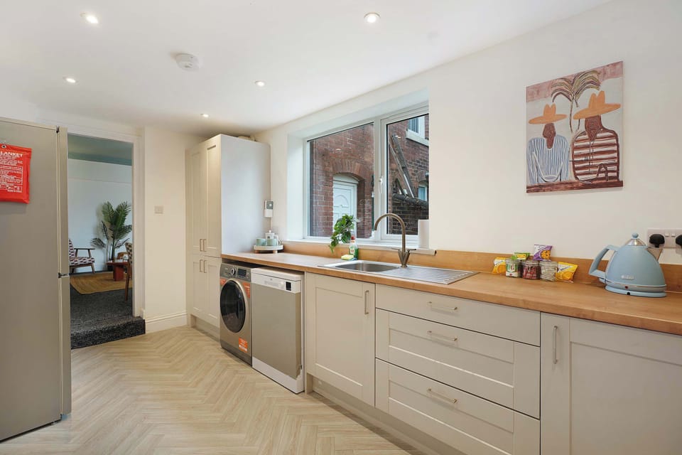Stretching across an inviting layout, the kitchen offers generous workspace, integrated appliances, and plenty of storage for everyday convenience. The practical setup makes shared meals and longer stays feel comfortable and easy to manage.