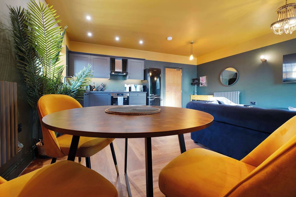 Enjoy meals at the stylish round dining table, offering a comfortable and welcoming space for everything from leisurely breakfasts to evening dinners with family or friends.